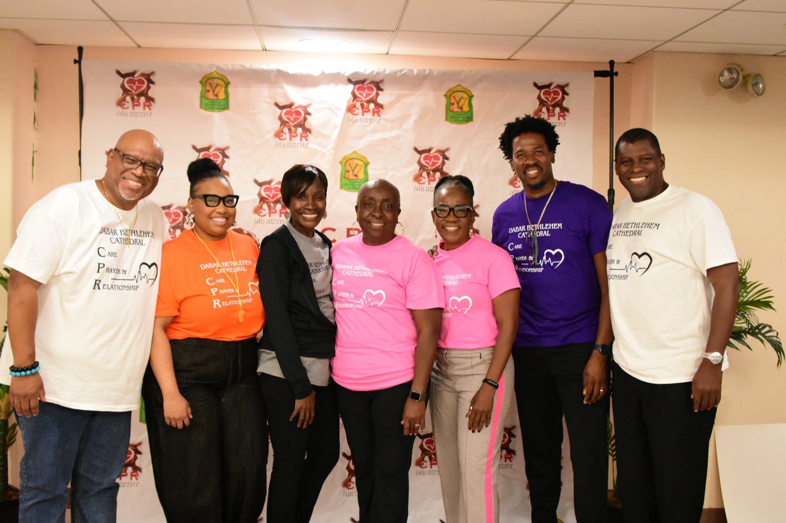Members of the Care, Prayer & Relationship (CPR) team smile together.