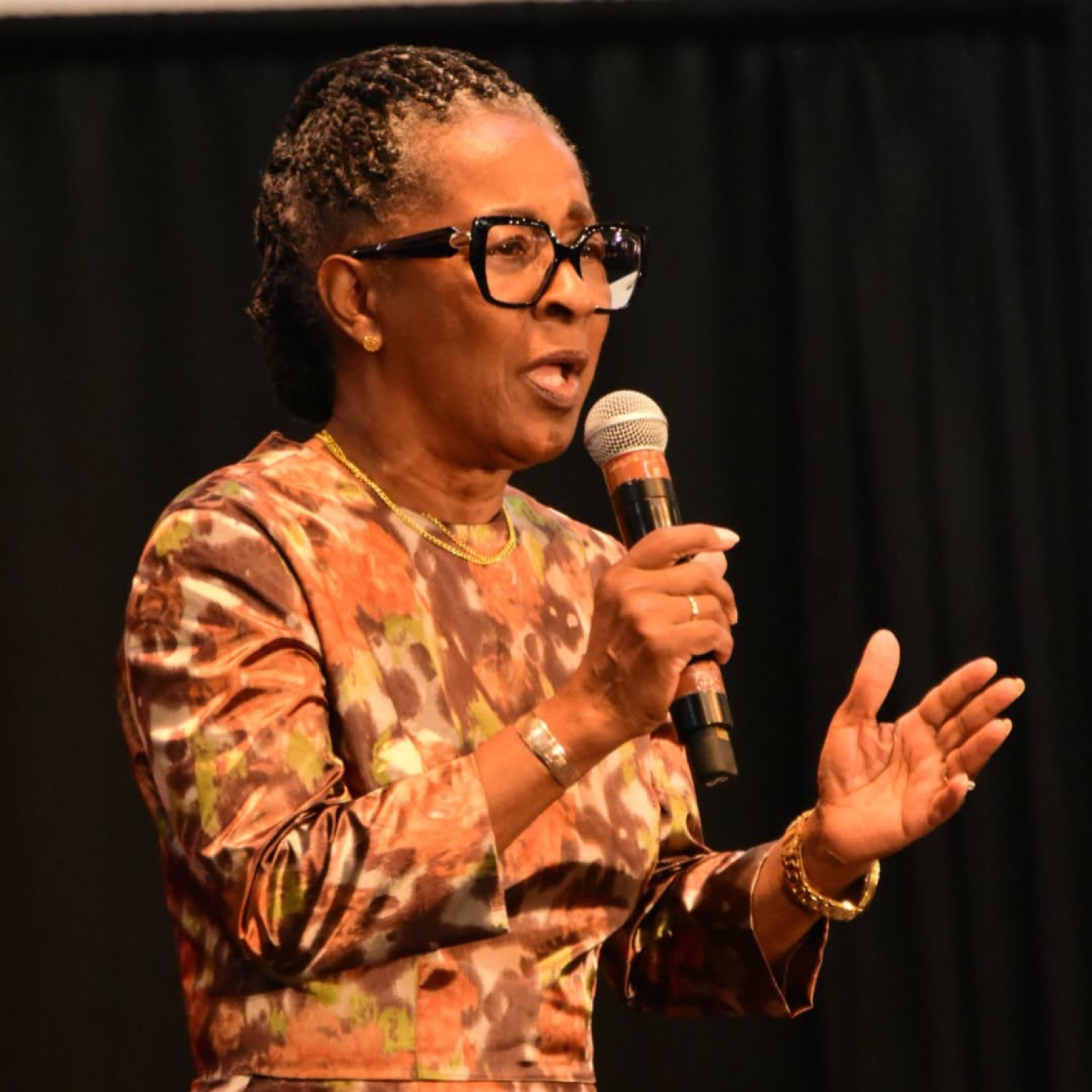 A speaker shares a word with the congregation.