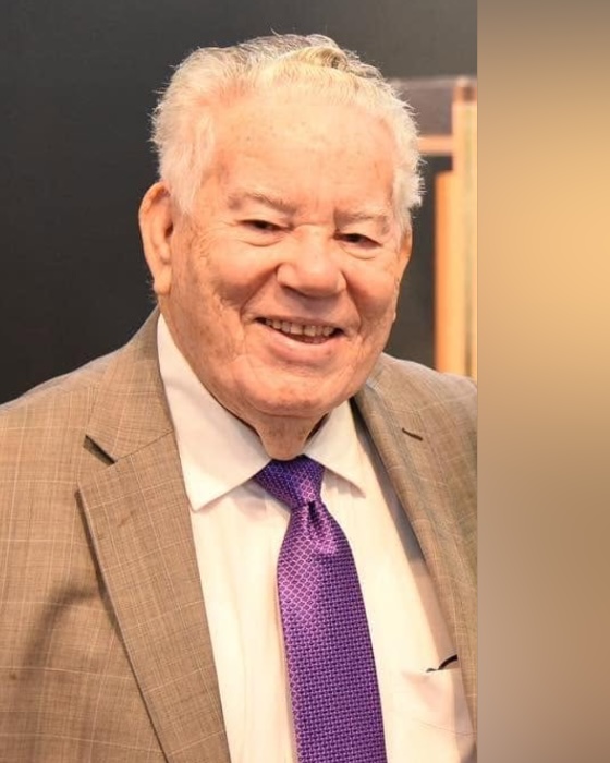 Portrait of Overseer Dr. Stanley M. Kidd, smiling broadly.